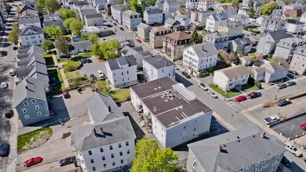 an aerial view of residential houses with outdoor space