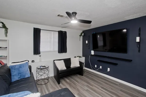 a living room with furniture and a fireplace