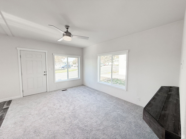 202 Darlington Way Layton, UT 84041 - Photo 5 of 17 Unfurnished living room featuring carpet flooring and a ceiling fan