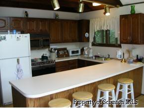1230 Brookfield Road Lake Ariel, PA 18436 - Photo 2 of 7 a kitchen with a refrigerator and a sink