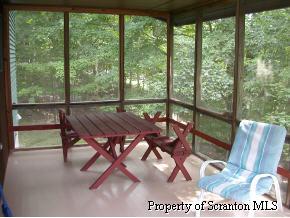 1230 Brookfield Road Lake Ariel, PA 18436 - Photo 7 of 7 a view of a dining room with furniture window and outside view