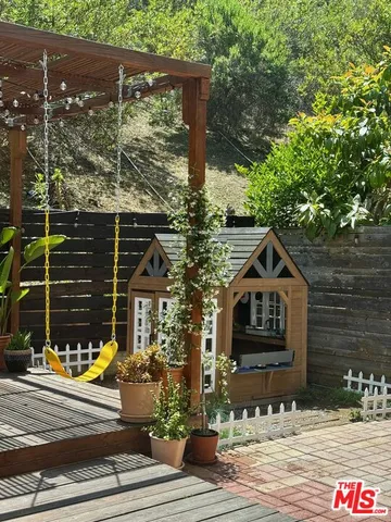 a view of a entryway with flower pots