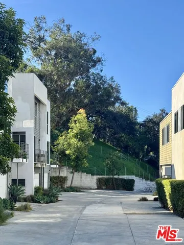 a view of a street with a building in the background