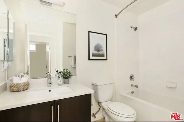 a utility room with sink washer and dryer