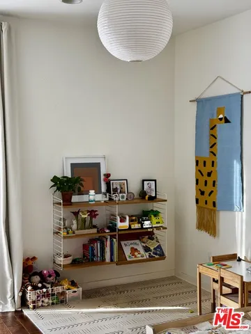 a view of a workspace with furniture and clutter