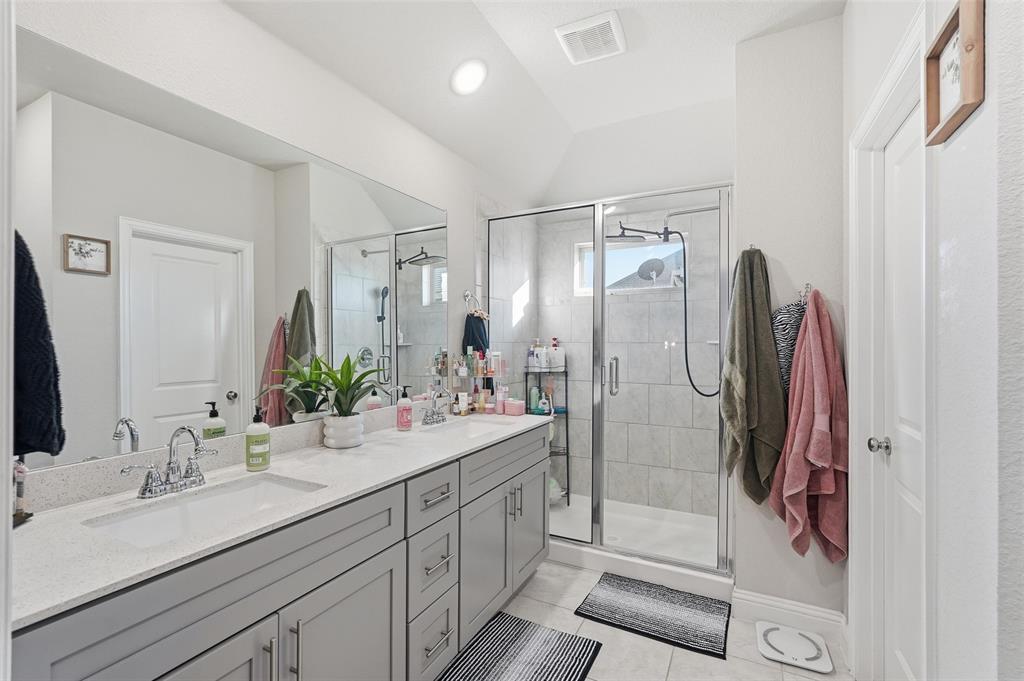 2148 Erika Lane Forney, TX 75126 - Photo 16 of 21 a bathroom with a double vanity sink mirror and shower