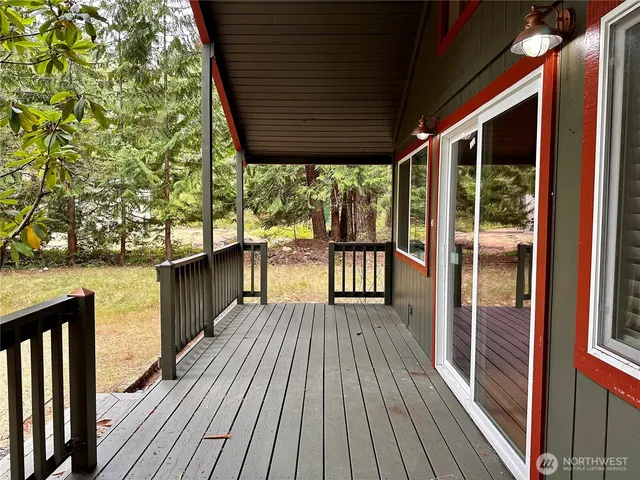 a view of balcony with wooden floor