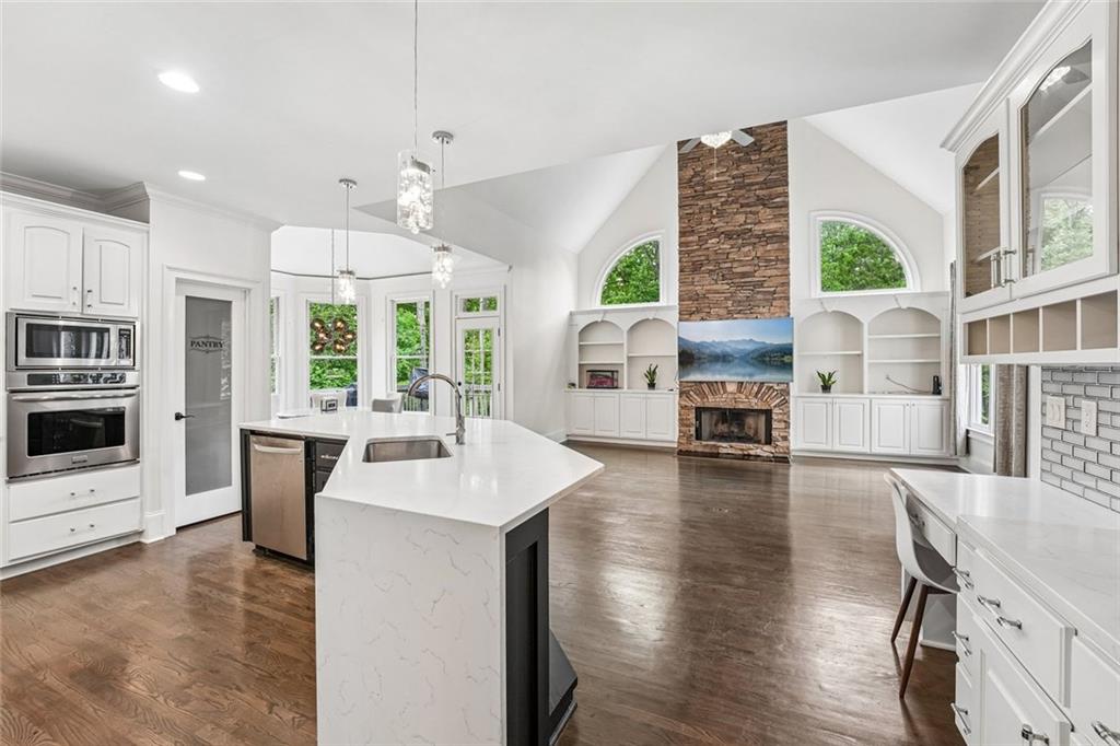 1091 Fieldstone Trail Milton, GA 30004 - Photo 21 of 84 a large kitchen with a table and chairs