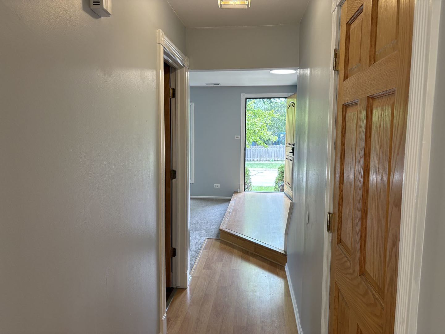 848 Birchbark Trail Carol Stream, IL 60188 - Photo 8 of 13 a view of a hallway with wooden floor and staircase