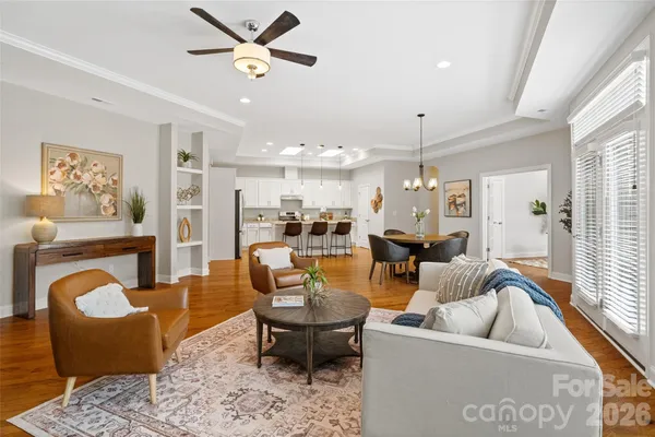 a view of a dining room with furniture window and wooden floor