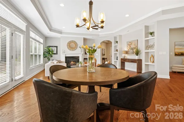 a kitchen with a stove cabinets and chairs