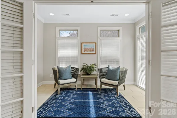 a view of a livingroom with furniture and a window