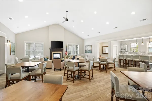 a large kitchen with a table and chairs