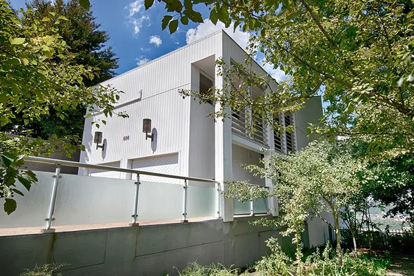 a view of a house with a tree