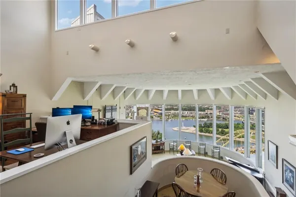 a room with gym equipment and windows