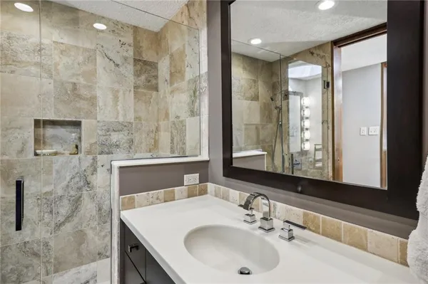 a bathroom with a sink and a mirror