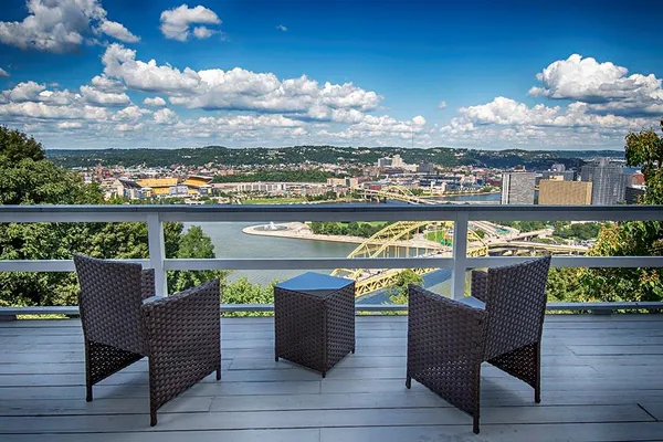 a view of a balcony with city view