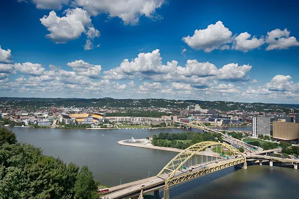 an aerial view of a city with lake view