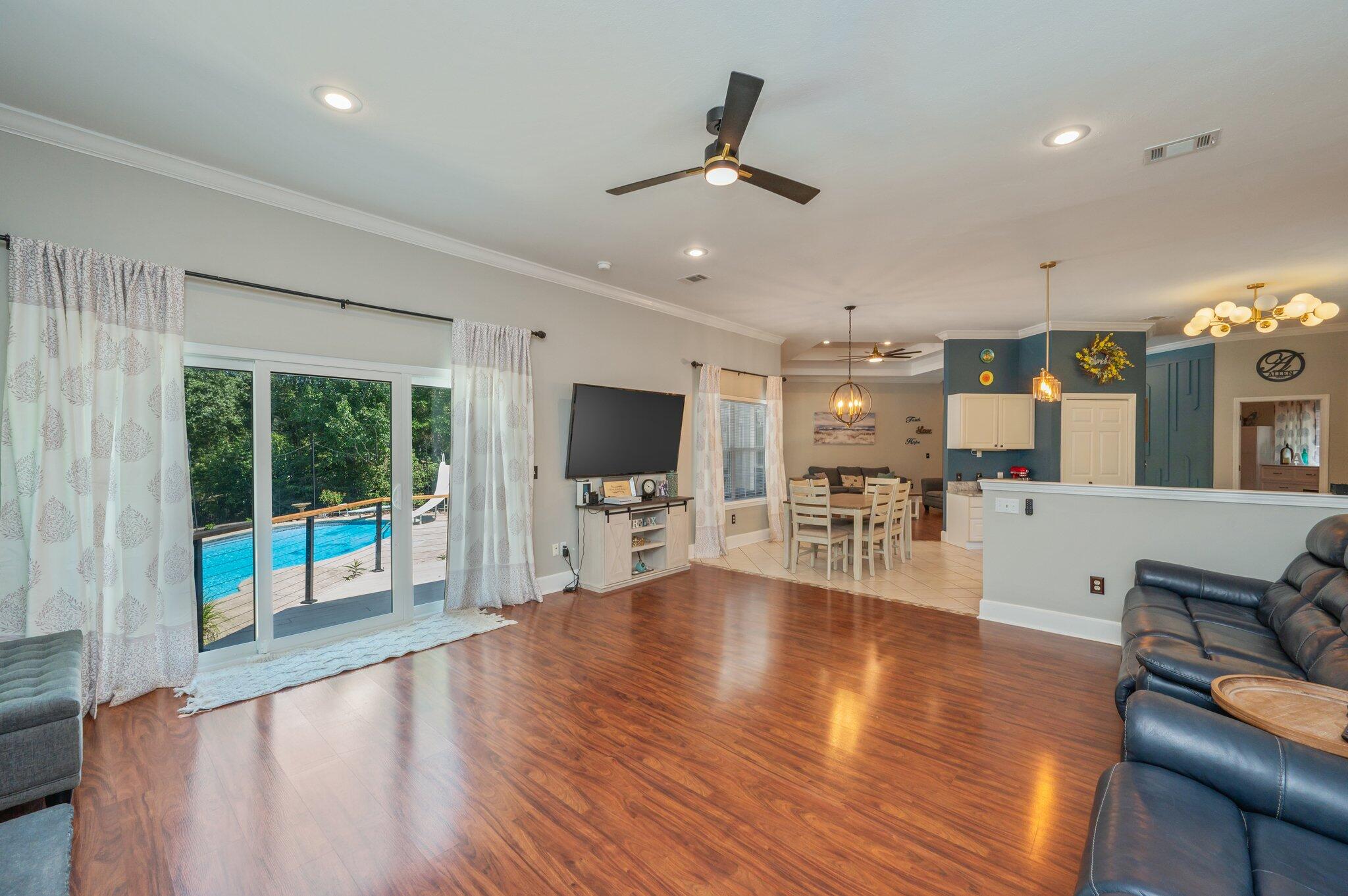 4680 Lovegrass Lane Crestview, FL 32539 - Photo 11 of 49 a living room with furniture and a flat screen tv