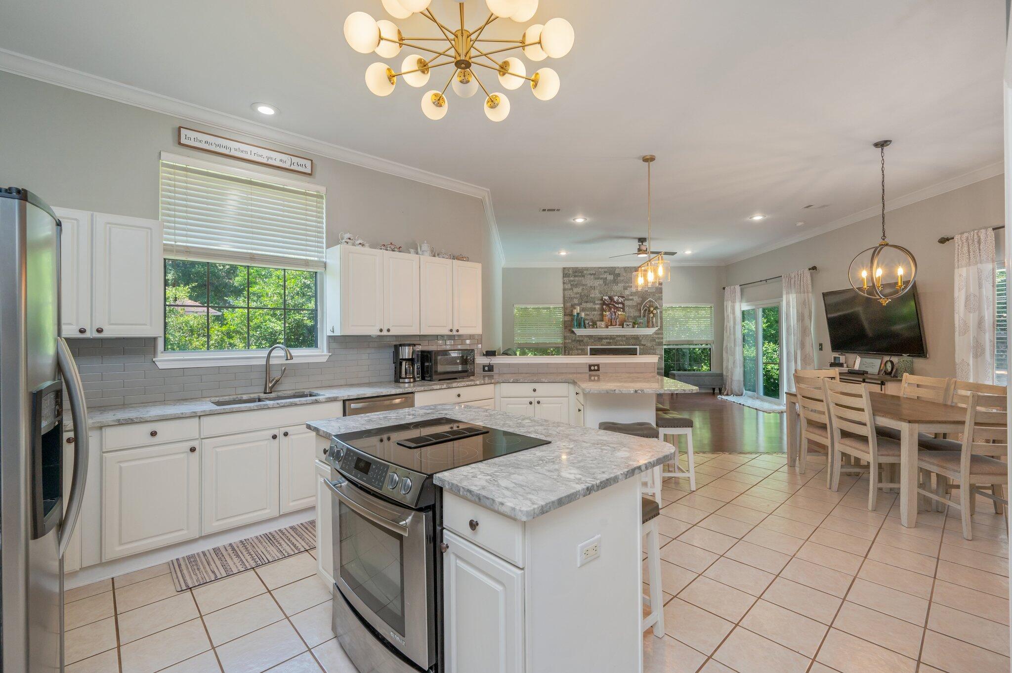 4680 Lovegrass Lane Crestview, FL 32539 - Photo 13 of 49 a kitchen that has a lot of cabinets in it