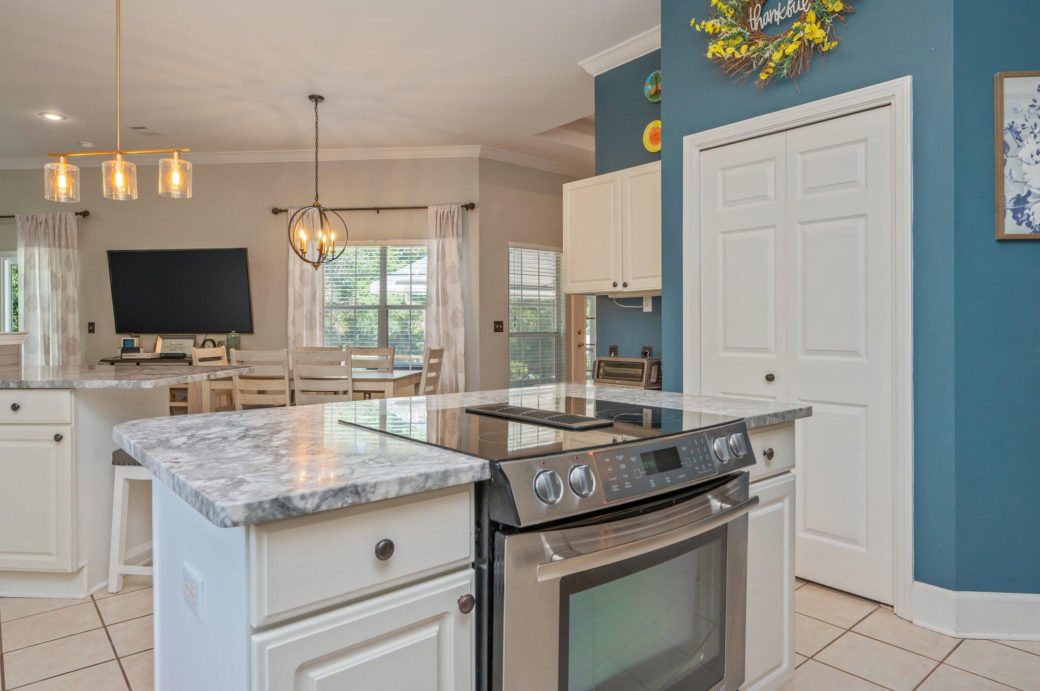 4680 Lovegrass Lane Crestview, FL 32539 - Photo 15 of 49 a kitchen with a stove and a sink