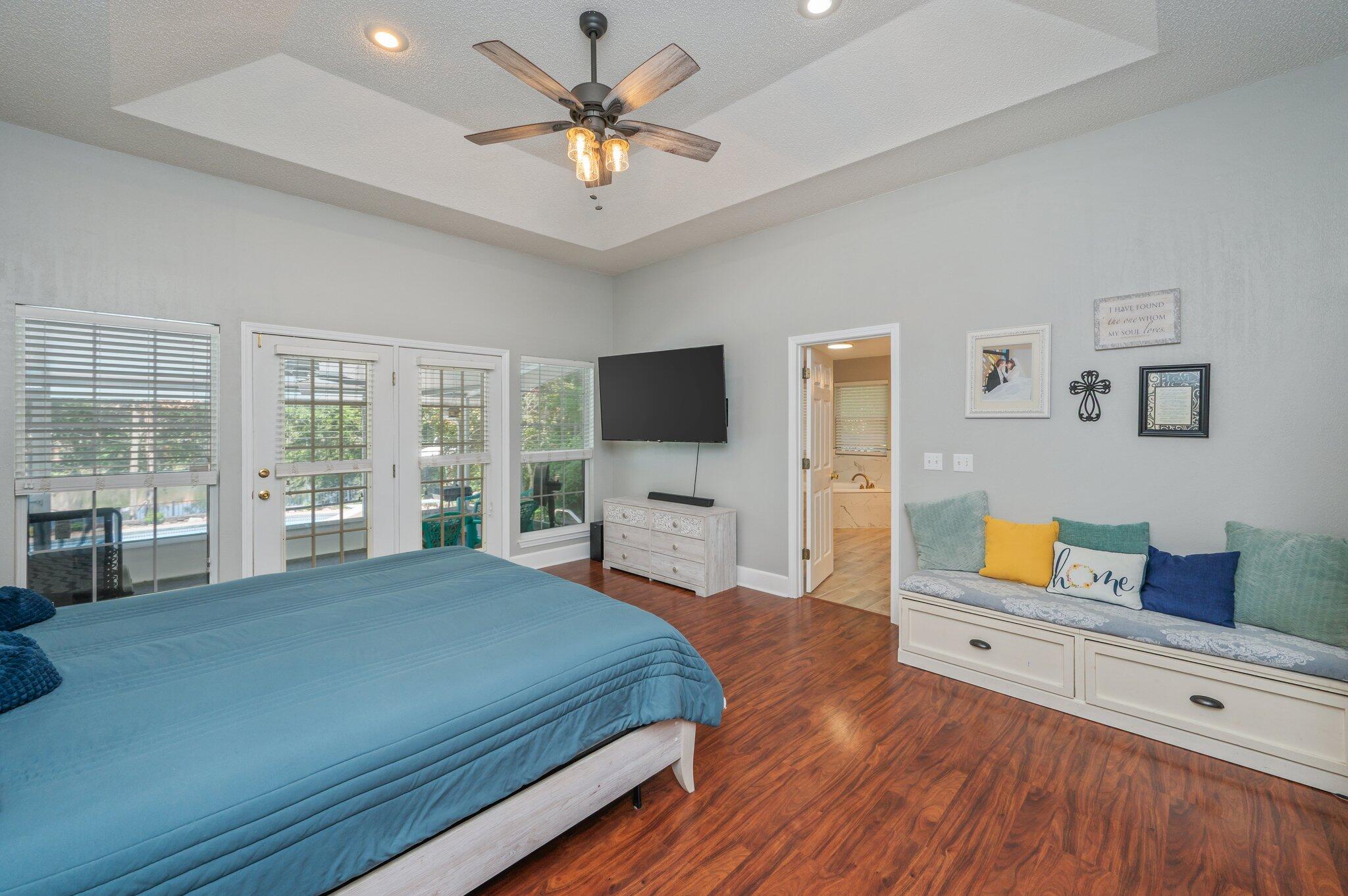 4680 Lovegrass Lane Crestview, FL 32539 - Photo 19 of 49 a bedroom with a bed and a flat screen tv