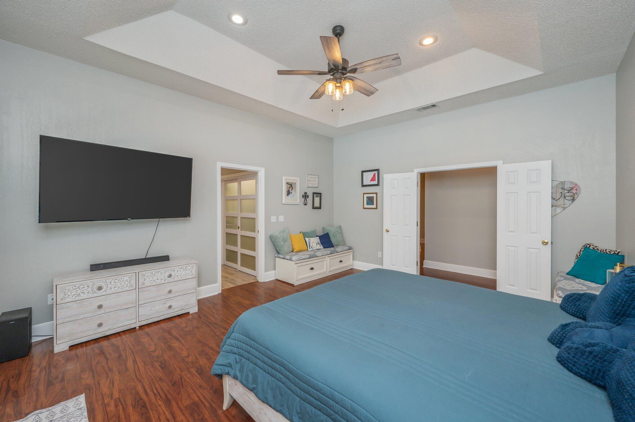 4680 Lovegrass Lane Crestview, FL 32539 - Photo 20 of 49 a bedroom with furniture and a flat screen tv