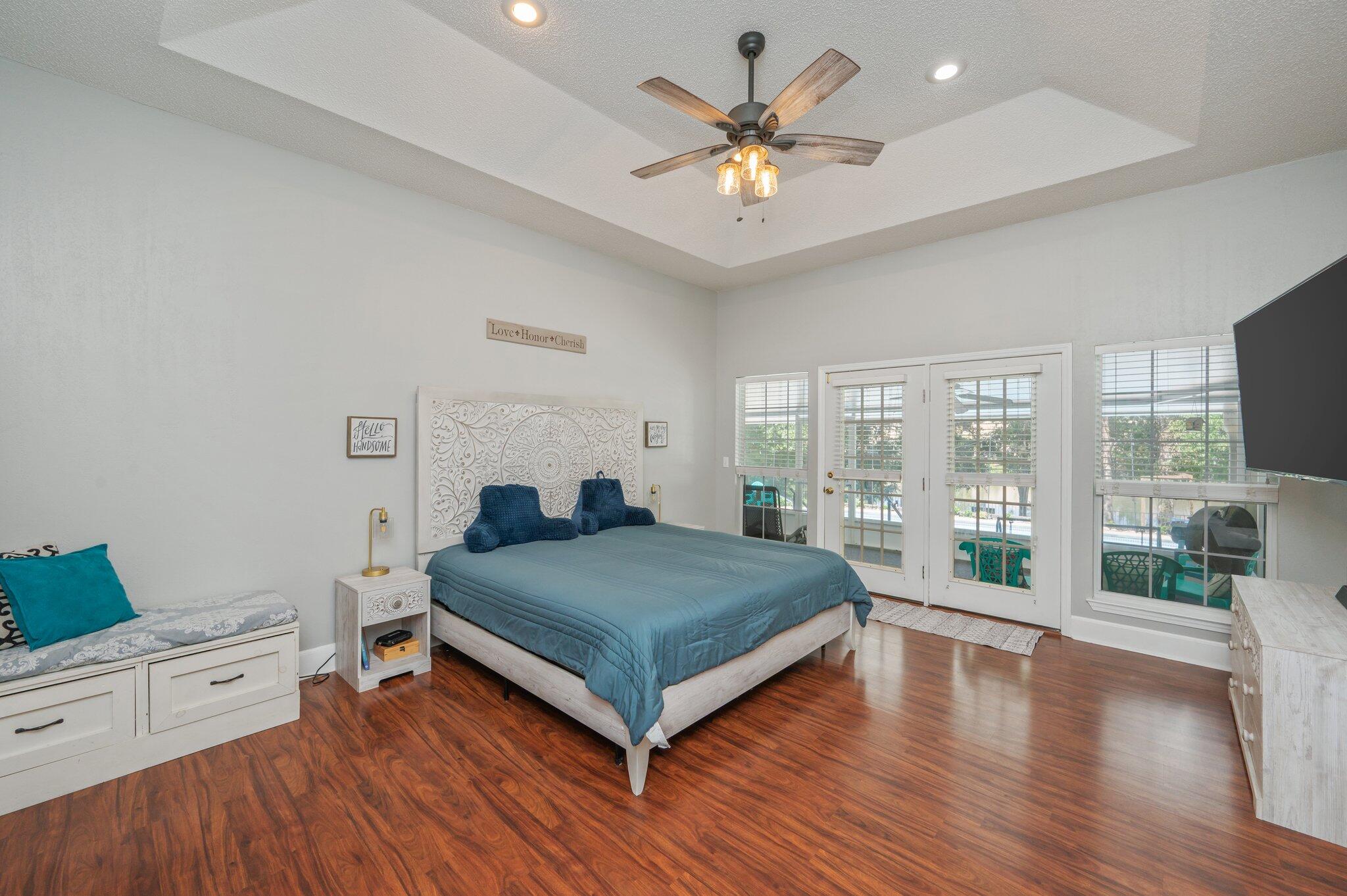 4680 Lovegrass Lane Crestview, FL 32539 - Photo 21 of 49 a bedroom with a large bed and a large window
