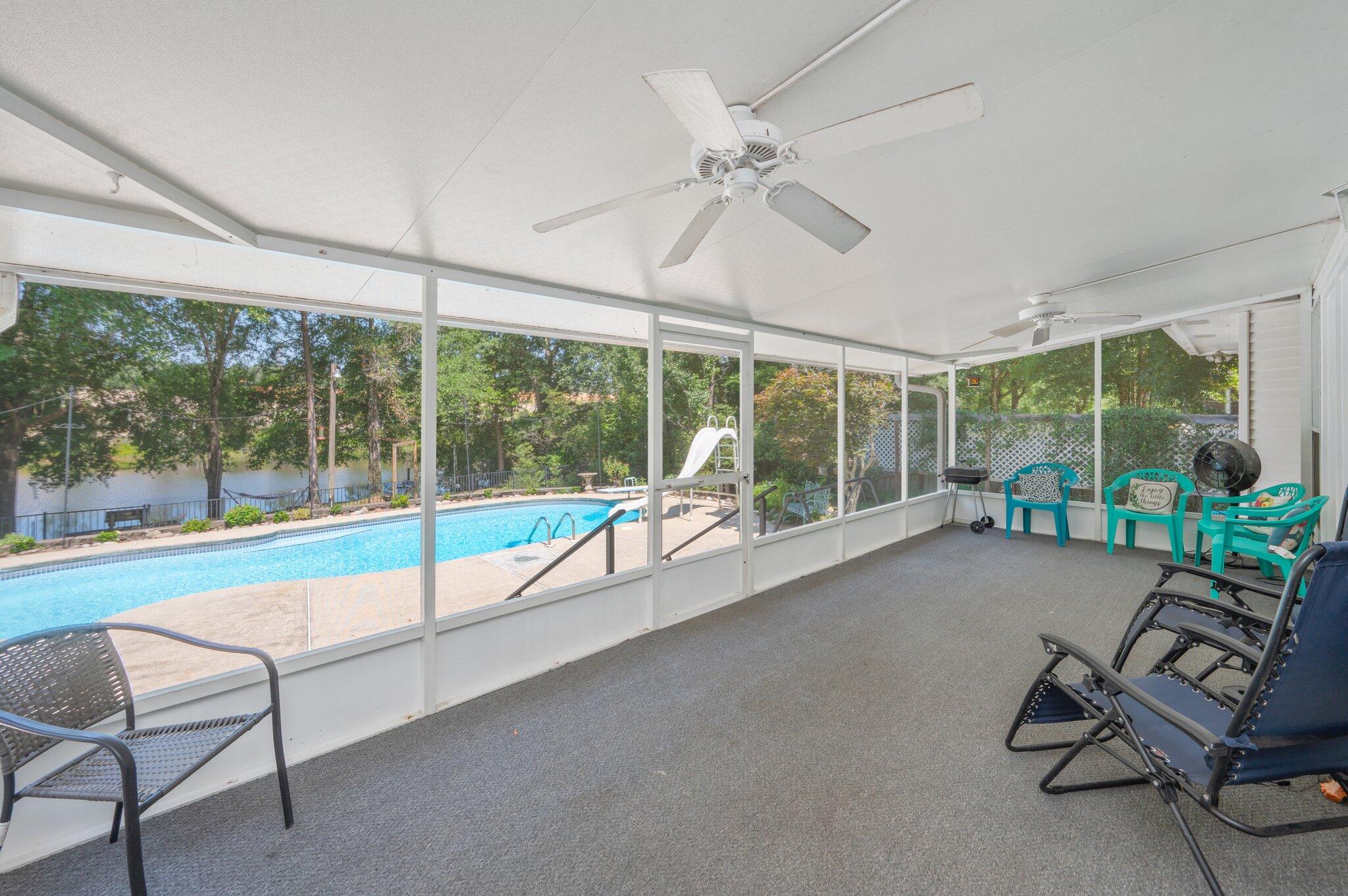 4680 Lovegrass Lane Crestview, FL 32539 - Photo 32 of 49 a view of a room with gym equipment and large windows