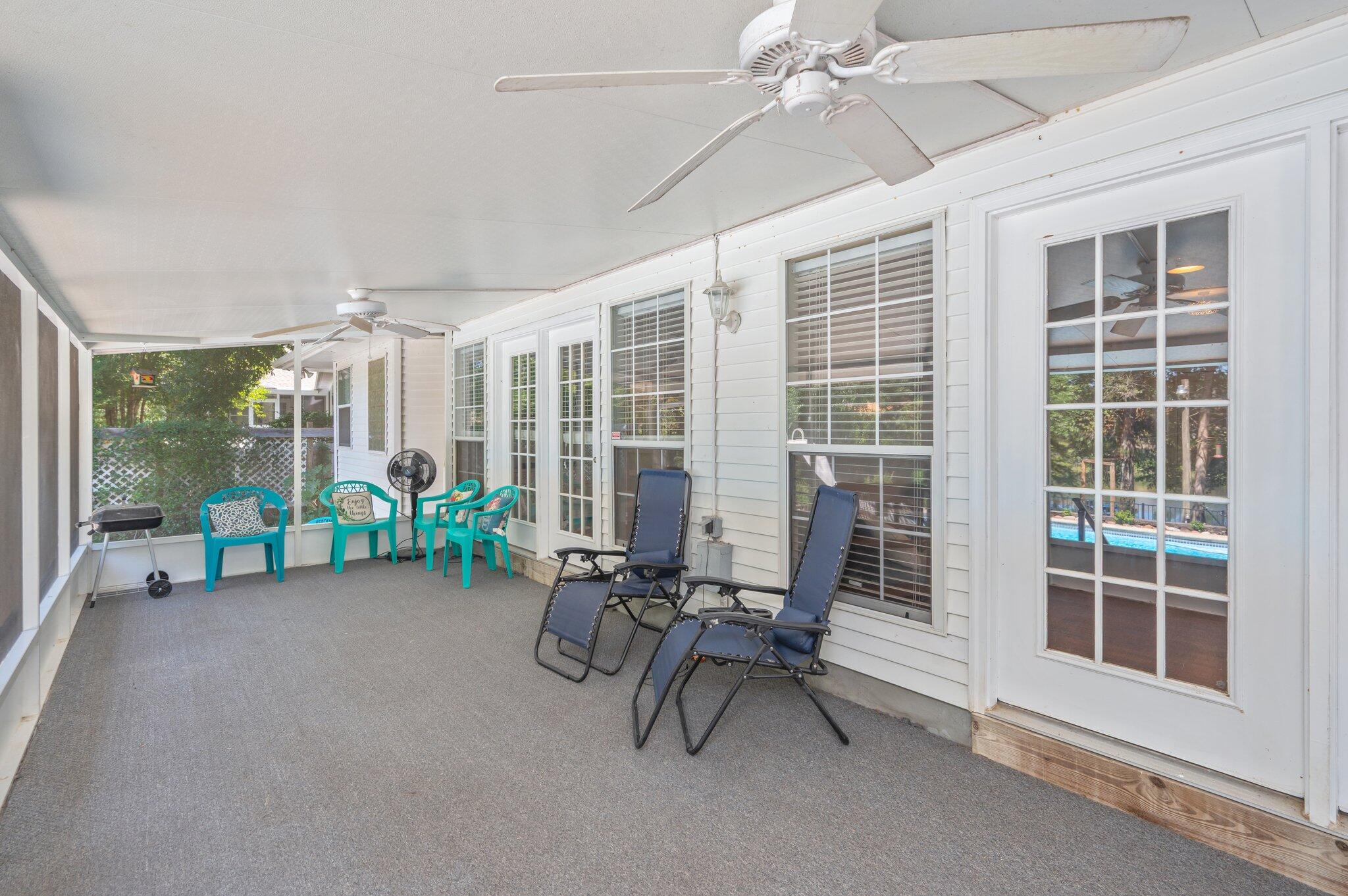 4680 Lovegrass Lane Crestview, FL 32539 - Photo 34 of 49 a view of a livingroom with furniture and floor to ceiling window