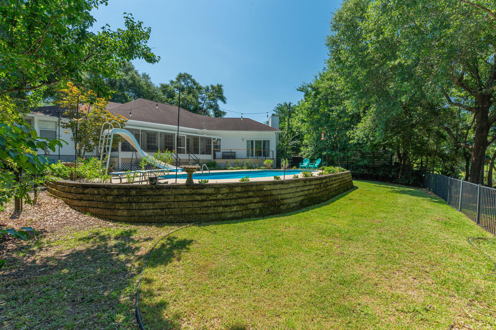 4680 Lovegrass Lane Crestview, FL 32539 - Photo 39 of 49 a view of swimming pool with large trees and grass