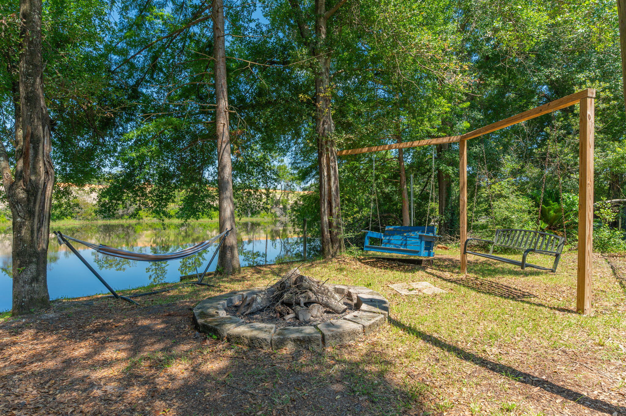 4680 Lovegrass Lane Crestview, FL 32539 - Photo 42 of 49 a view of a yard with swimming pool and sitting area