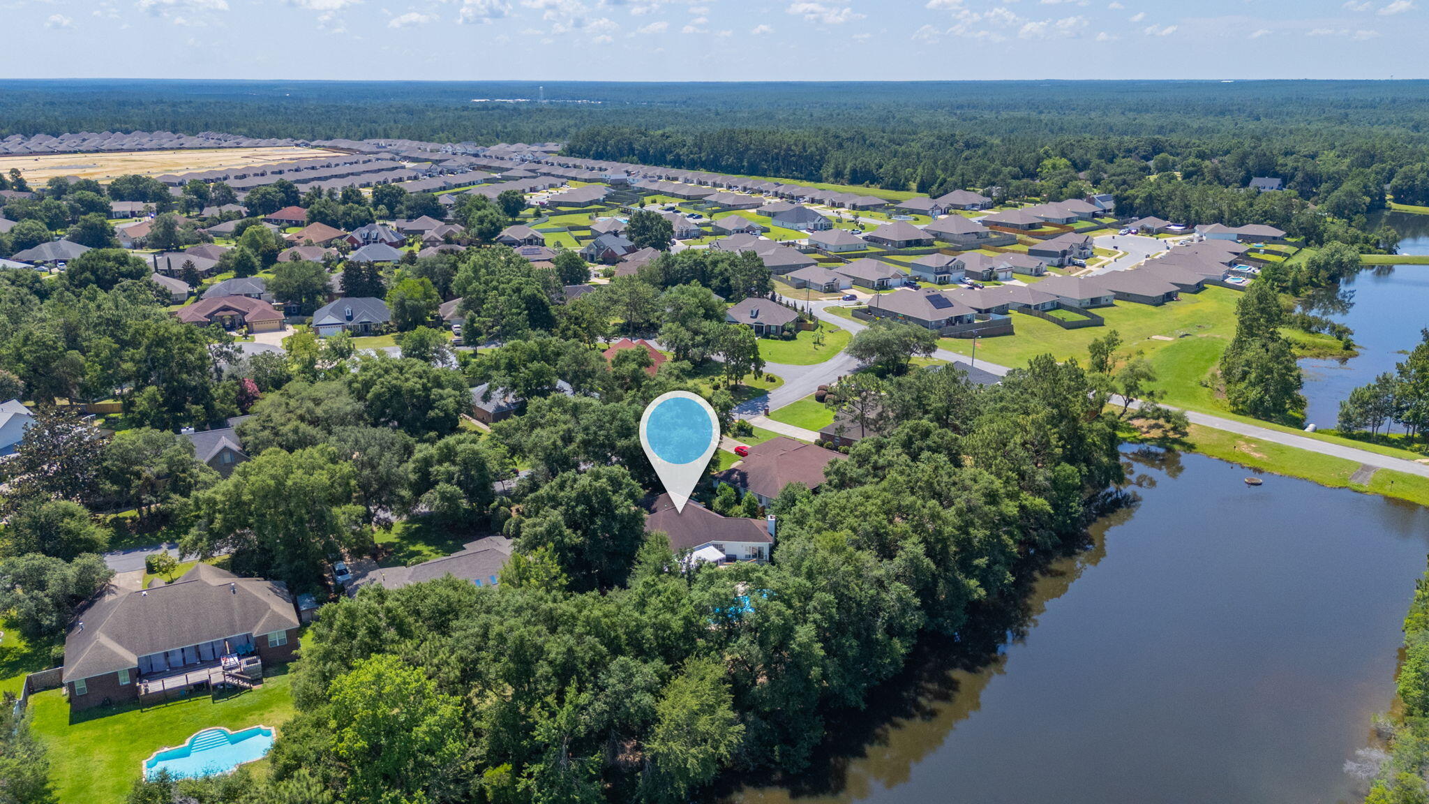 4680 Lovegrass Lane Crestview, FL 32539 - Photo 43 of 49 an aerial view of a house with a garden