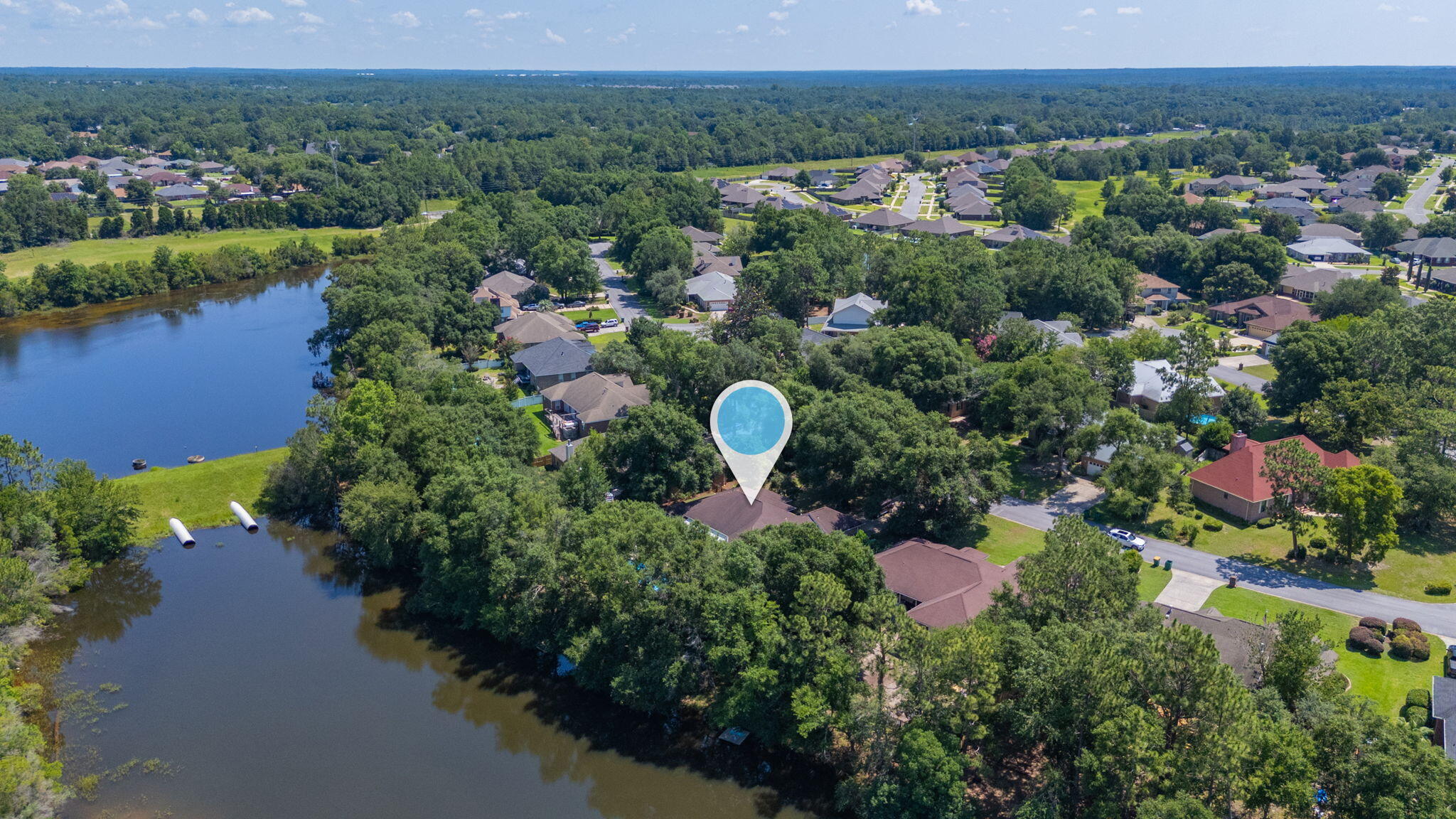 4680 Lovegrass Lane Crestview, FL 32539 - Photo 44 of 49 an aerial view of a house with a yard and lake view