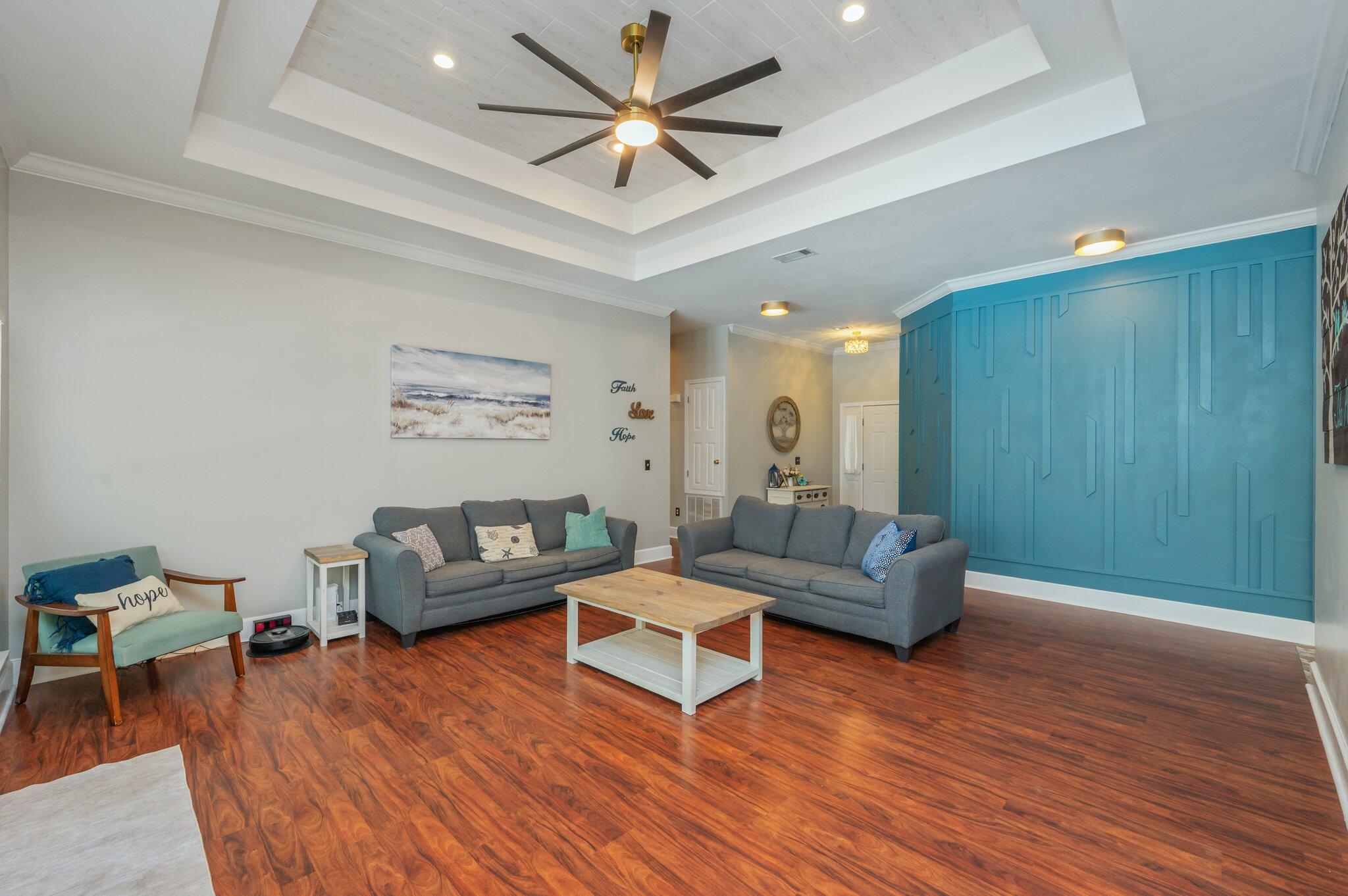 4680 Lovegrass Lane Crestview, FL 32539 - Photo 7 of 49 a living room with furniture and a wooden floor