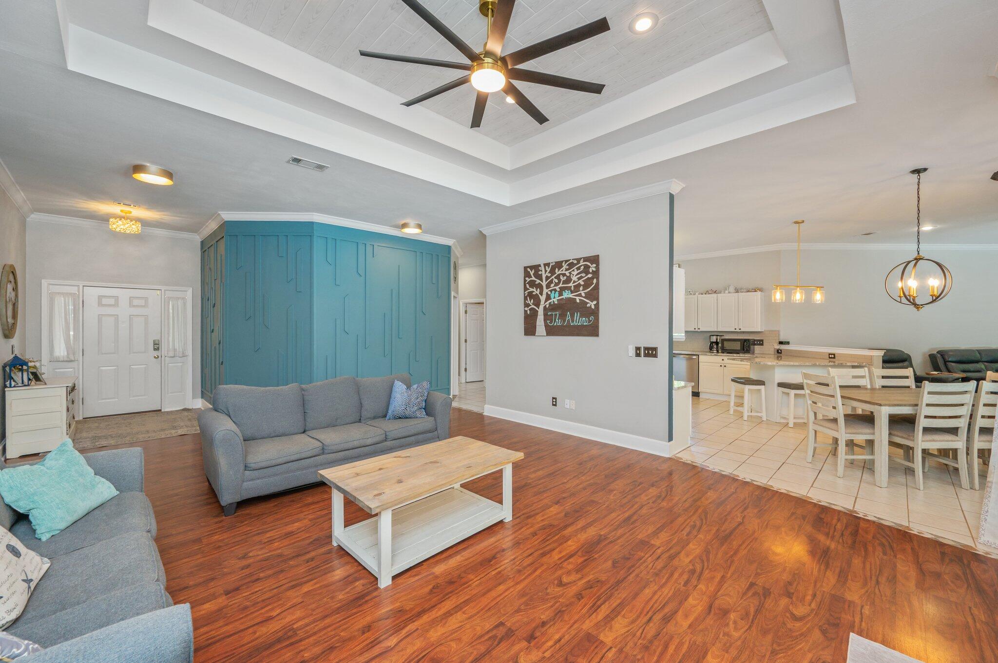 4680 Lovegrass Lane Crestview, FL 32539 - Photo 8 of 49 a living room with furniture and a wooden floor