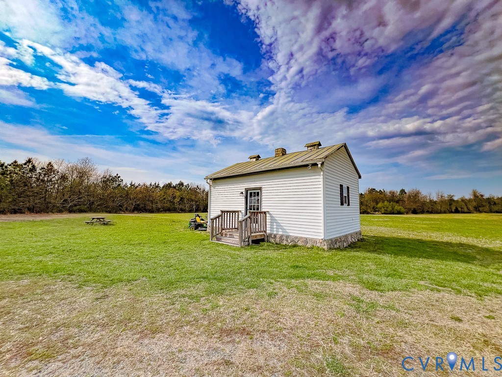 18262 Seals Road Bowling Green, VA 22427 - Photo 33 of 50 a view of a house with a yard