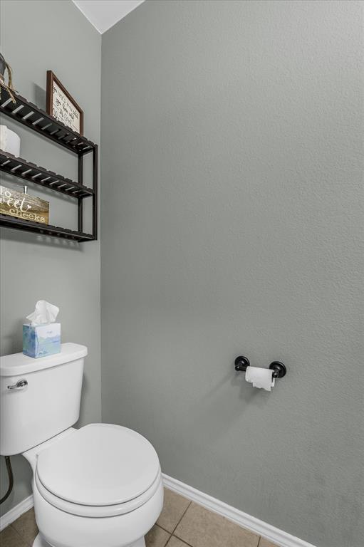 9453 Centennial Drive Waco, TX 76708 - Photo 17 of 37 a white toilet sitting next to a bathroom sink