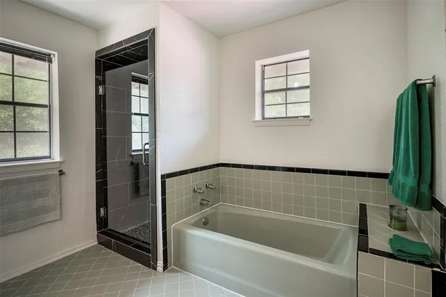 a view of a house with pool and a yard