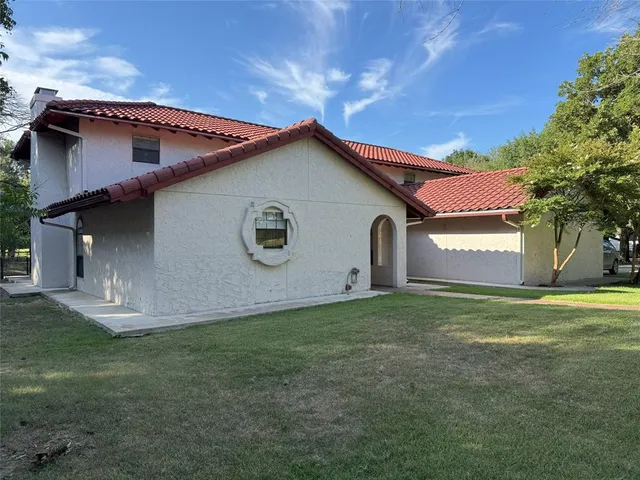 a view of swimming pool with a patio