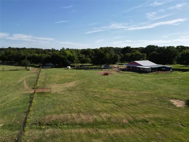 a view of a lake with houses in the back
