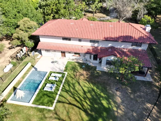 a living room with furniture fireplace and wooden floor