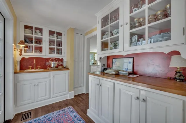 a kitchen with a sink and cabinets