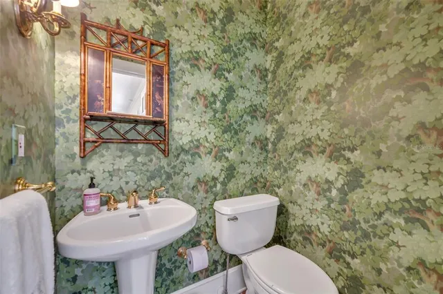 a living room with fireplace furniture and a large window