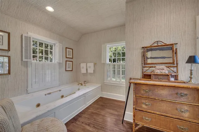 a living room with furniture a lamp and a table