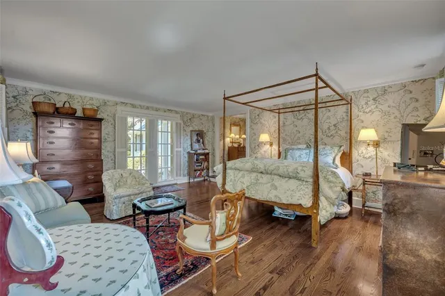 a spacious bathroom with a tub sink and mirror