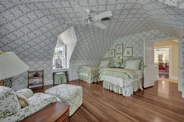 a spacious bathroom with a granite countertop sink a toilet and a mirror