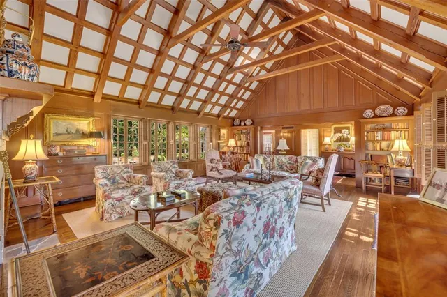 a living room with lots of furniture and a chandelier