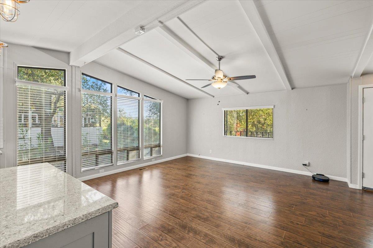4420 Pleasant Valley Road, Unit 184 Diamond Springs, CA 95619 - Photo 13 of 28 an empty room with wooden floor and windows