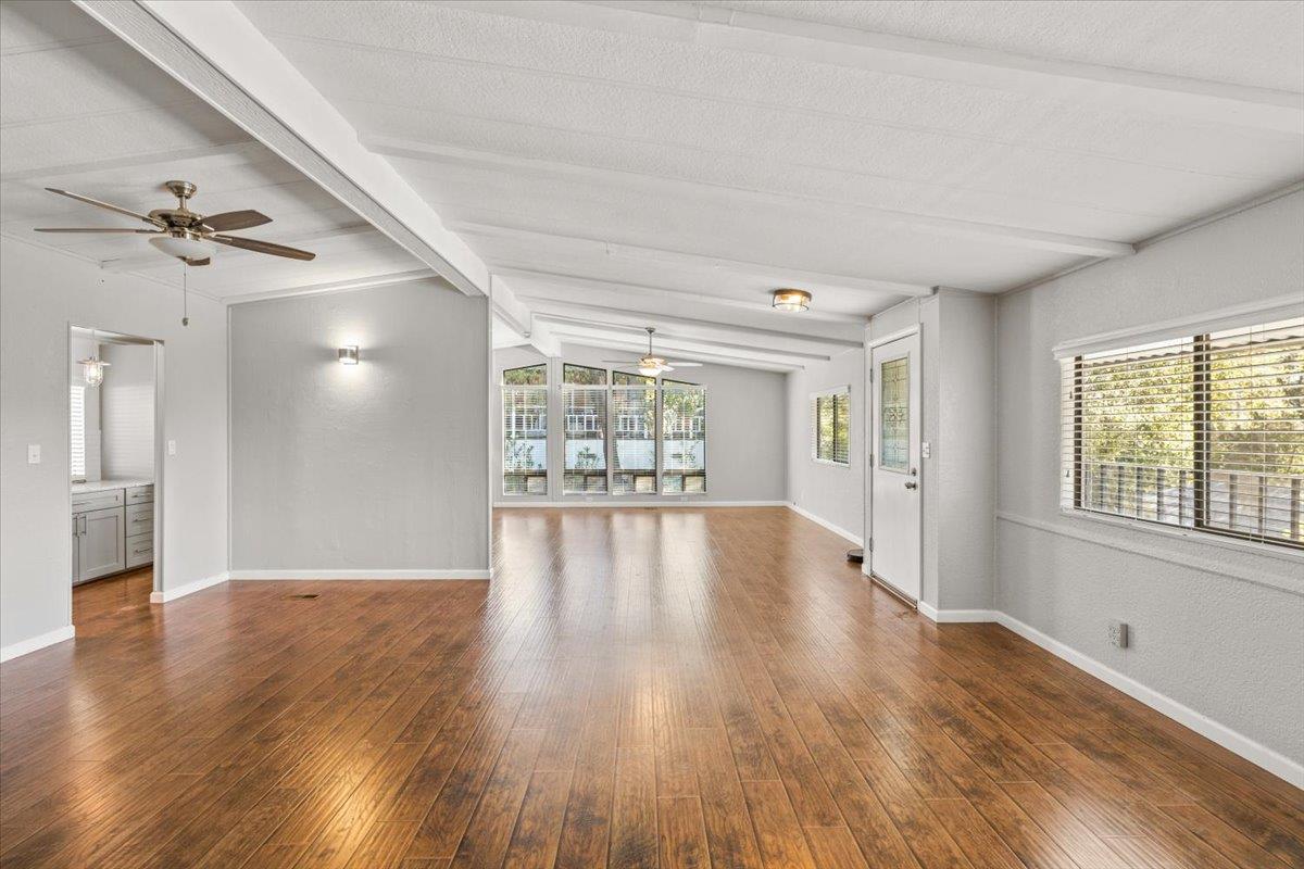 4420 Pleasant Valley Road, Unit 184 Diamond Springs, CA 95619 - Photo 14 of 28 a view of an empty room with a window and wooden floor